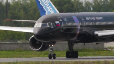 NOVOSIBIRSK, RUSSIAN FEDERATION - JULY 15, 2022: Passenger plane of Azur Air with Lujo Art Joy Livery taxiing to the runway. Premium jet aircraft on taxiway. Tourism and travel concept