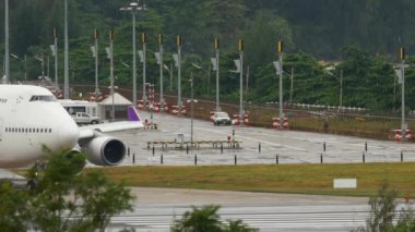 PHUKET, THAILAND - DECEMBER 02, 2016: Boeing 747 of Thai Airways taxiing on runway before take off at Phuket airport. Jumbo jet departure