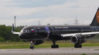 NOVOSIBIRSK, RUSSIAN FEDERATION - JULY 15, 2022: Jet plane of Azur Air with Lujo Art Joy Livery taxiing to the runway before take off. Tourism and travel concept