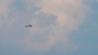 SOCHI, RUSSIA - JULY 28, 2022: Commercial passenger aircraft of Aeroflot approaching landing, long shot front view. Airplane flight, arrival. Tourism and travel concept