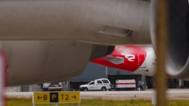 PHUKET, THAILAND - DECEMBER 05, 2016: Close sht of engine and chassis. Wheels rubber tire rear landing gear racks airplane aircraft, under wing view