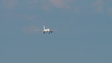 SOCHI, RUSSIA - JULY 28, 2022: Long shot front view passenger jet aircraft Airbus A320, RA-73812 of Yamal Airlines approaching landing in Sochi airport. Tourism and travel concept