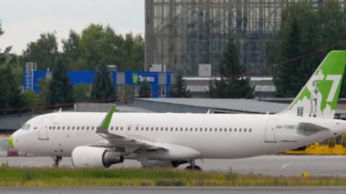 NOVOSIBIRSK, RUSSIAN FEDERATION - JULY 15, 2022: Airplane of Airlines S7 Airlines taxiing at Tolmachevo airport. Tourism and travel concept