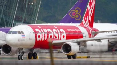 PHUKET, THAILAND - NOVEMBER 26, 2017: Jet passenger Asian aircraft Airbus A320, HS-BBG of AirAsia on the airfield Phuket airport. Tourism and travel concept