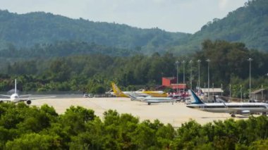 PHUKET, THAILAND - NOVEMBER 26, 2019: Landing, takeoff of aircraft. Timelapse of airport traffic. Footage of airfield Phuket