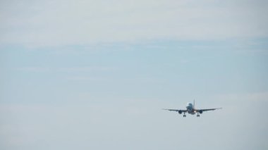 PHUKET, THAILAND - DECEMBER 02, 2018: Airbus A320 of AirAsia landing at Phuket International Airport. Airplane flies for landing, traffic. Tourism and travel concept