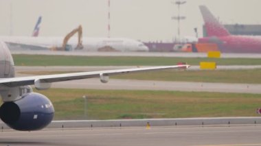 MOSCOW, RUSSIAN FEDERATION - JULY 28, 2021: Airplane of Aeroflot taxiing at Sheremetyevo airport. Civil aircraft on the taxiway. Tourism and travel concept