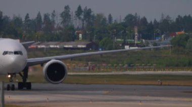 MOSCOW, RUSSIAN FEDERATION - JULY 29, 2021: Boeing 777 of Nordwind airlines taxiing at Sheremetyevo airport, front view. Airplane on the airfield. Tourism and travel concept.