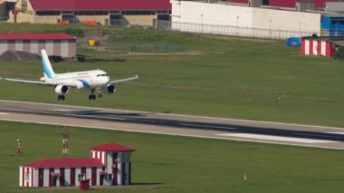 SOCHI, RUSSIA - JULY 28, 2022: Passenger jet aircraft Airbus A320 of Yamal Airlines landing at Sochi airport. Tourism and travel concept