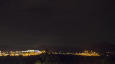 Time lapse of aviation traffic. Footage of the airport airfield at night. Airport illumination at night