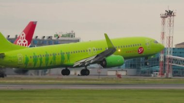 NOVOSIBIRSK, RUSSIAN FEDERATION - JUNE 10, 2020: Boeing 737, VQ-BRK of S7 Airlines landing, touching at Tolmachevo airport. Passenger flight arrival. Tourism and travel concept