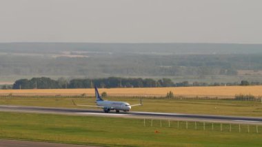 KAZAN, RUSSIA - AUGUST 05, 2022: Side view of passenger jet airplane Boeing 737 AnadoluJet take off, departure at Kazan airport. Tourism and travel concept