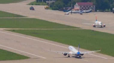 SOCHI, RUSSIA - JULY 28, 2022: Civil jet plane of Ural Airlines takeoff and climb at Sochi International Airport. Tourism and travel concept.
