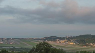 Timelapse panoramic view of the airport in daytime traffic. Clouds float beautifully over the city. Panoramic view of the runway