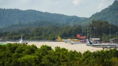 PHUKET, THAILAND - NOVEMBER 26, 2019: Timelapse of airport traffic. Footage of airfield Phuket. Aircraft landings and takeoffs