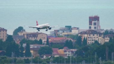 SOCHI, RUSSIA - JULY 27, 2022: Passenger airplane of NordWind landing at Sochi Airport. Tourism and travel concept. Aviation traffic