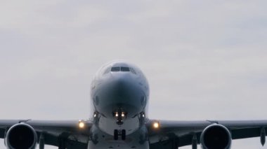 PHUKET, THAILAND - JANUARY 26, 2023: Airbus A330 of Turkish landing, flying overhead. Passenger flight arrival at Phuket airport. Chassis release