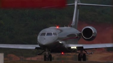 Footage of private business jet taxiing. Airfield. Airplane silhouette on the taxiway