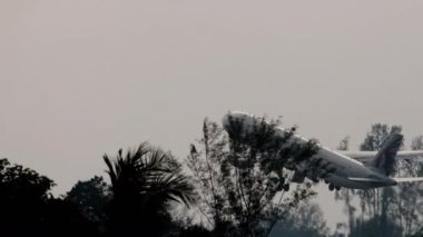 PHUKET, THAILAND - JANUARY 31, 2023: Footage of Airbus A330, A7-AEF of Qatar Airways takes off, climb at Phuket airport. Passenger flight departure. Tourism and travel concept