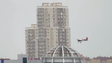 KAZAN, RUSSIAN FEDERATION, JUNE 14, 2019: Sports light aircraft performing aerobatics at the Red Bull competition in Kazan