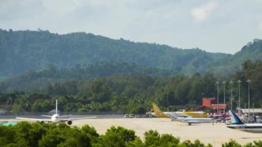 PHUKET, THAILAND - NOVEMBER 26, 2019: Timelapse of airport traffic. Footage of airfield Phuket. Aircraft landings and takeoffs