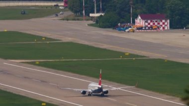 SOCHI, RUSSIA - JULY 31, 2022: Airplane of Nordwind speed up before taking off at Sochi International Airport. Airliner departure, slow motion. Tourism and travel concept