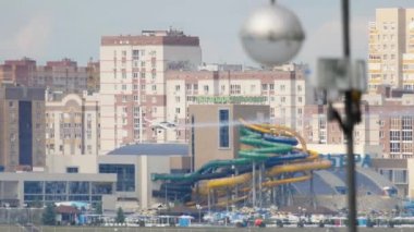 KAZAN, RUSSIAN FEDERATION, JUNE 15, 2019: Red Bull airplane races at Red Bull Air Races. Tricks and aerobatics in the air. Racing sports aircraft on the background of the city