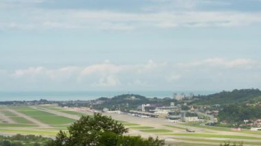 Cinematic shot of traffic at the airport, panoramic view of the airfield. timelapse