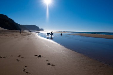 Peaceful and beautiful coast of Portugal. Beautiful ocean beach landscape. Blue sky. Sand.