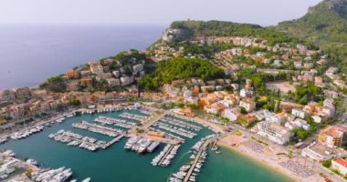 Majorca, Spain. Aerial view of summer resort town Port de Soller on Mallorca Majorca island, sandy beach, boats, yachts, clear waters of Mediterranean Sea - landscape of Balearic Islands from above
