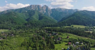 Aerial view of Zakopane in Tatra mountains - beautiful landscape and houses at the foot of the mountains in summer. Poland