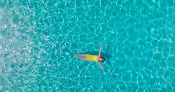 Top View Woman Yellow Swimsuit Lying Her Back Pool Relaxing — 图库视频影像