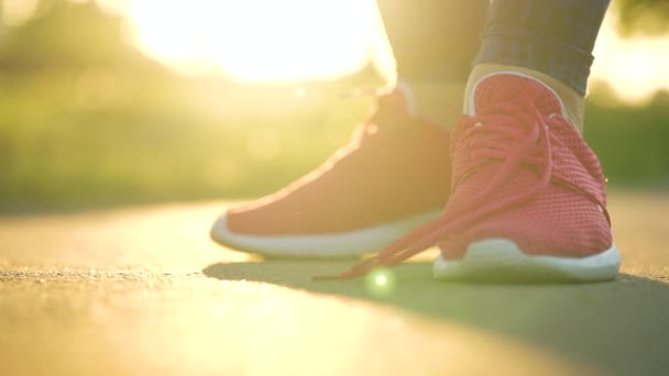 Woman Tying Shoelaces While Jogging Walking Sunset Close Slow Motion — Stock Video