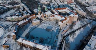 Aerial view of Wawel Royal Castle and Cathedral covered with snow in winter. Sunny frosty day. Krakow, Poland