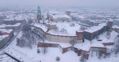 Aerial view of Wawel Royal Castle and Cathedral covered with snow in winter. Gloomy frosty day. Krakow, Poland