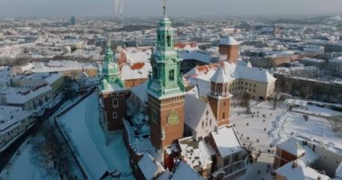 Aerial view of Wawel Royal Castle and Cathedral covered with snow in winter. Sunny frosty day. Krakow, Poland