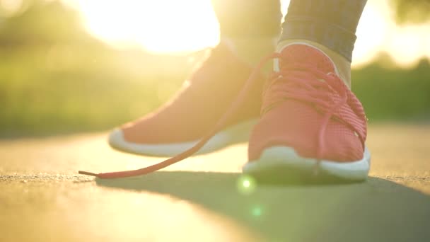 Woman Tying Shoelaces While Jogging Walking Sunset Close Slow Motion — Stock Video