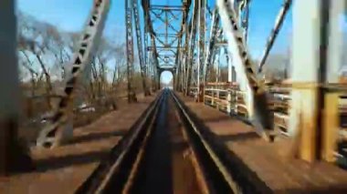Fast flight over the railway bridge. Filmed on FPV Drone.
