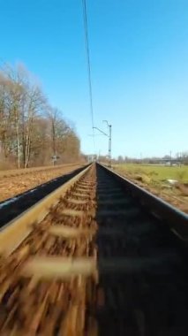 Vertical video. Fast flight over the railway. Filmed on FPV Drone.
