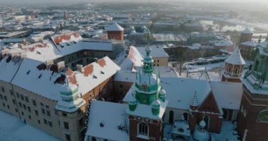 Aerial view of Wawel Royal Castle and Cathedral covered with snow in winter. Sunny frosty day. Krakow, Poland