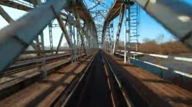 Fast flight over the railway bridge. Filmed on FPV Drone.