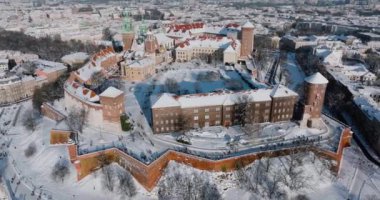 Aerial view of Wawel Royal Castle and Cathedral covered with snow in winter. Sunny frosty day. Krakow, Poland