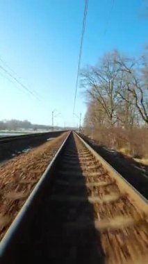 Vertical video. Fast flight over the railway. Filmed on FPV Drone.