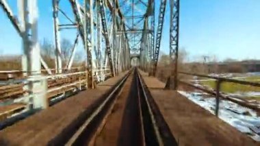 Fast flight over the railway bridge. Filmed on FPV Drone.