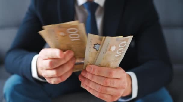 Formally Dressed Man Counting Canadian Dollar Bills Close Concept Investment — Video Stock