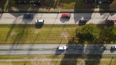 Top down view of city traffic. Cars drive tight dense on the road