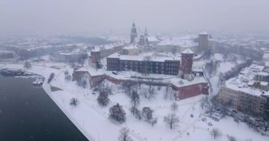 Aerial view of Wawel Royal Castle and Cathedral covered with snow in winter. Gloomy frosty day. Krakow, Poland