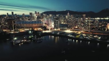 Aerial hyperlapse of night cityline with skyscrapers. Downtown of Vancouver, British Columbia, Canada.