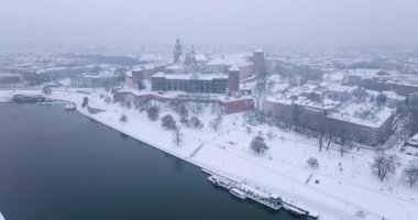 Aerial view of Wawel Royal Castle and Cathedral covered with snow in winter. Gloomy frosty day. Krakow, Poland