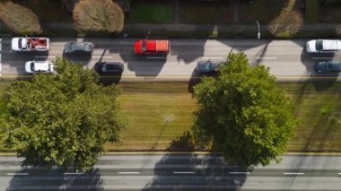 Top down view of city traffic. Cars drive tight dense on the road